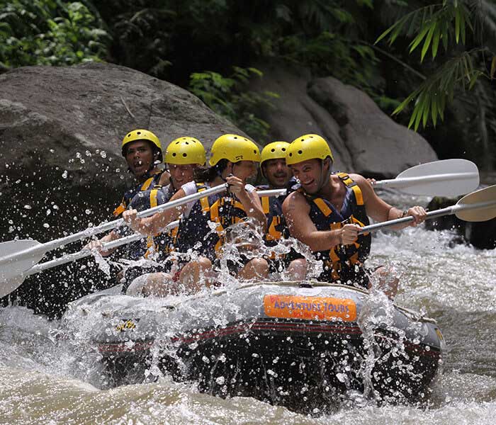 some people having fun with white water rafting in Bali