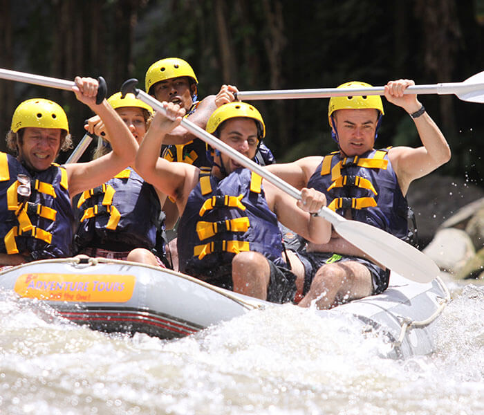 a team playing white water rafting in Ubud